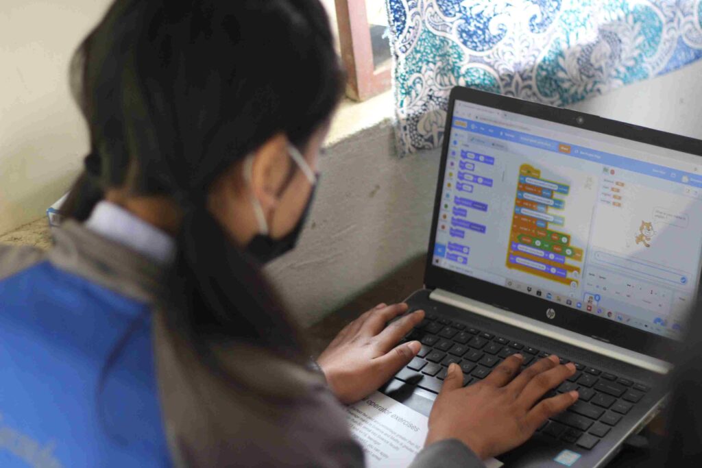 Student learning Scratch in Code Chautari Class